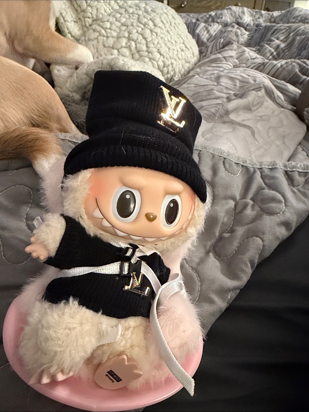 Louis Vuitton Plush Doll in Black Knit Hat & Cream Fur in car seat